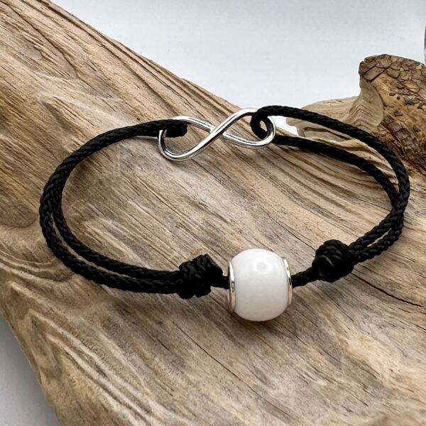 Pandorastilperle mit Muttermilch; mit Unentlichkeitssymbol aus Silber